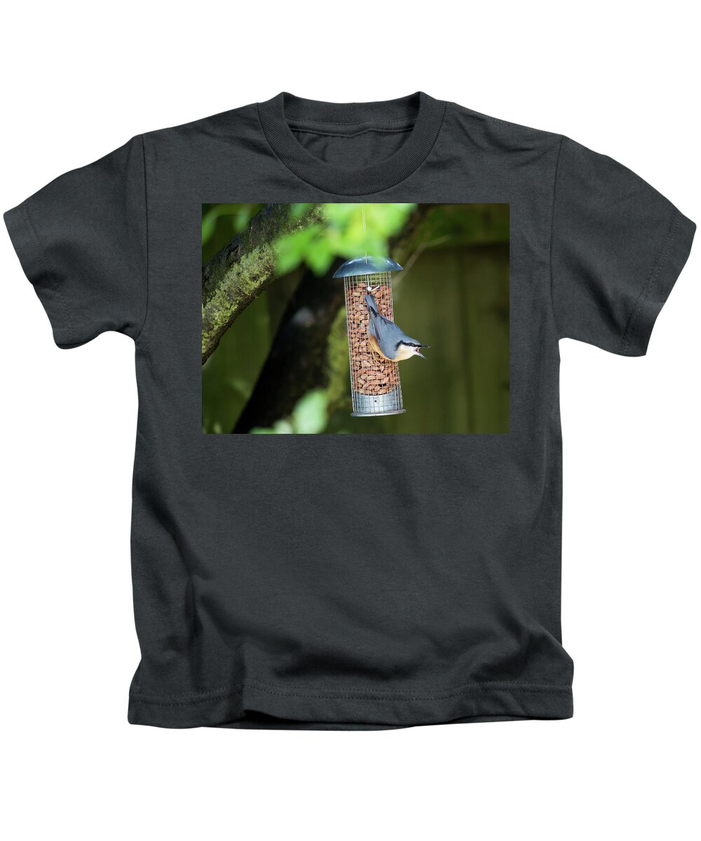 Nuthatch Kids T-Shirt featuring the photograph Nuthatch on peanut bird feeder by Anita Nicholson