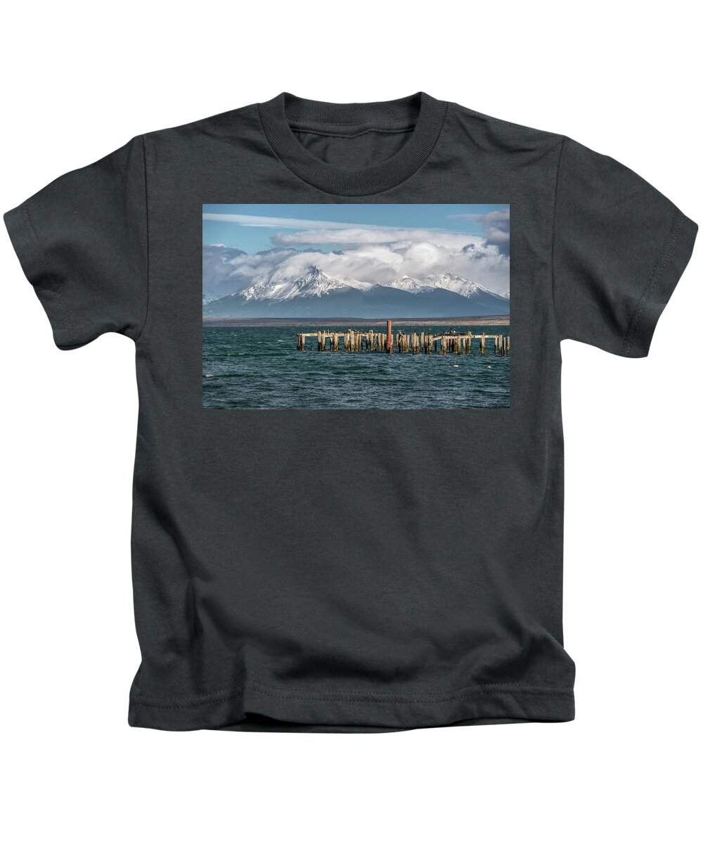 Andes Kids T-Shirt featuring the photograph Puerto Natales Braun and Blanchard pier and White-breasted Cormorants by Henri Leduc