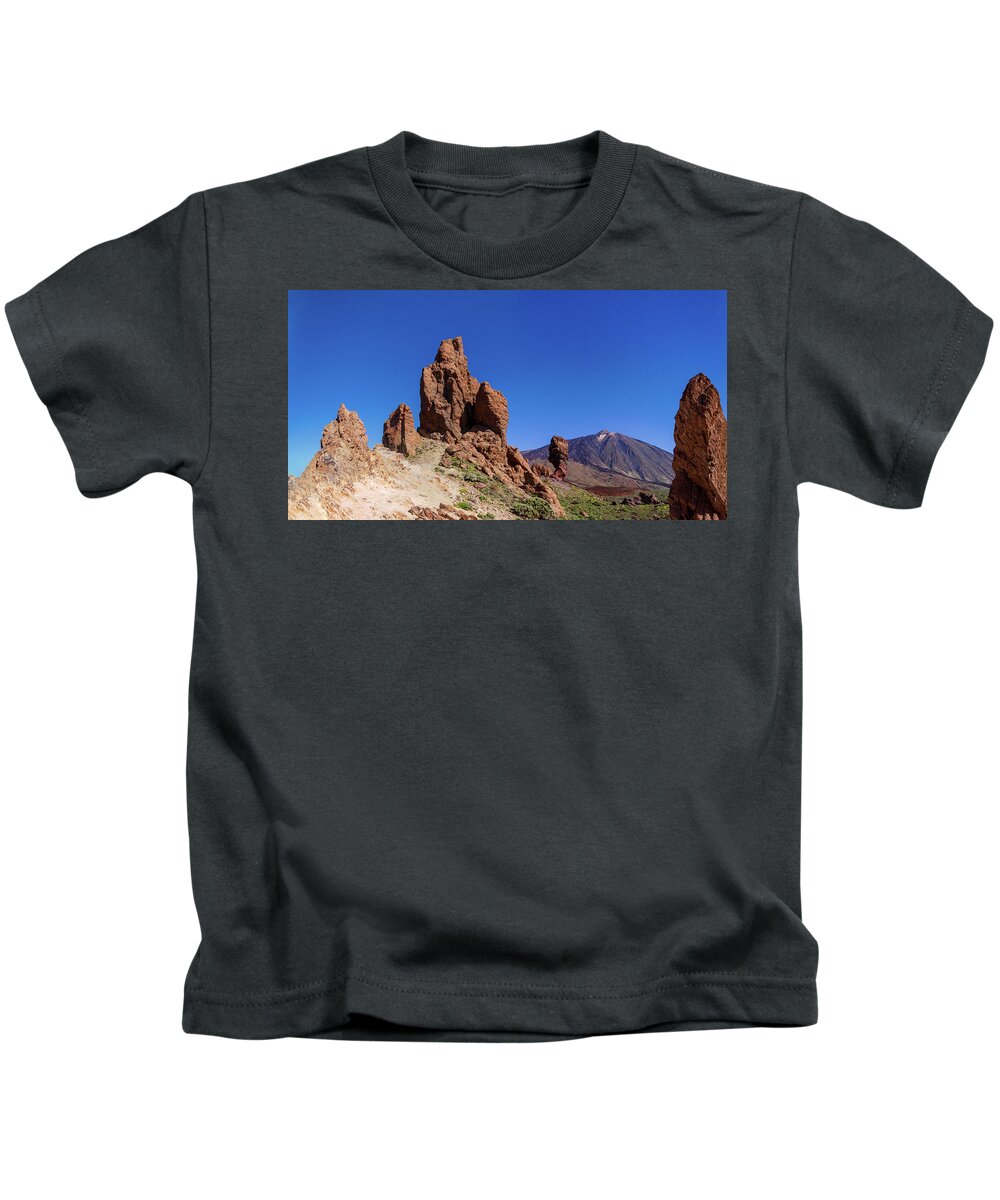 Mountains Kids T-Shirt featuring the photograph Red rocks in front of Mount Teide by Sun Travels