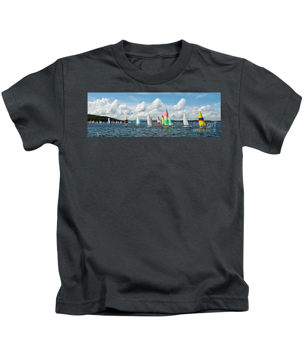 Dinghies Kids T-Shirt featuring the photograph Regatta Panorama. Children Sailing small sailboats Catamarans wi by Geoff Childs