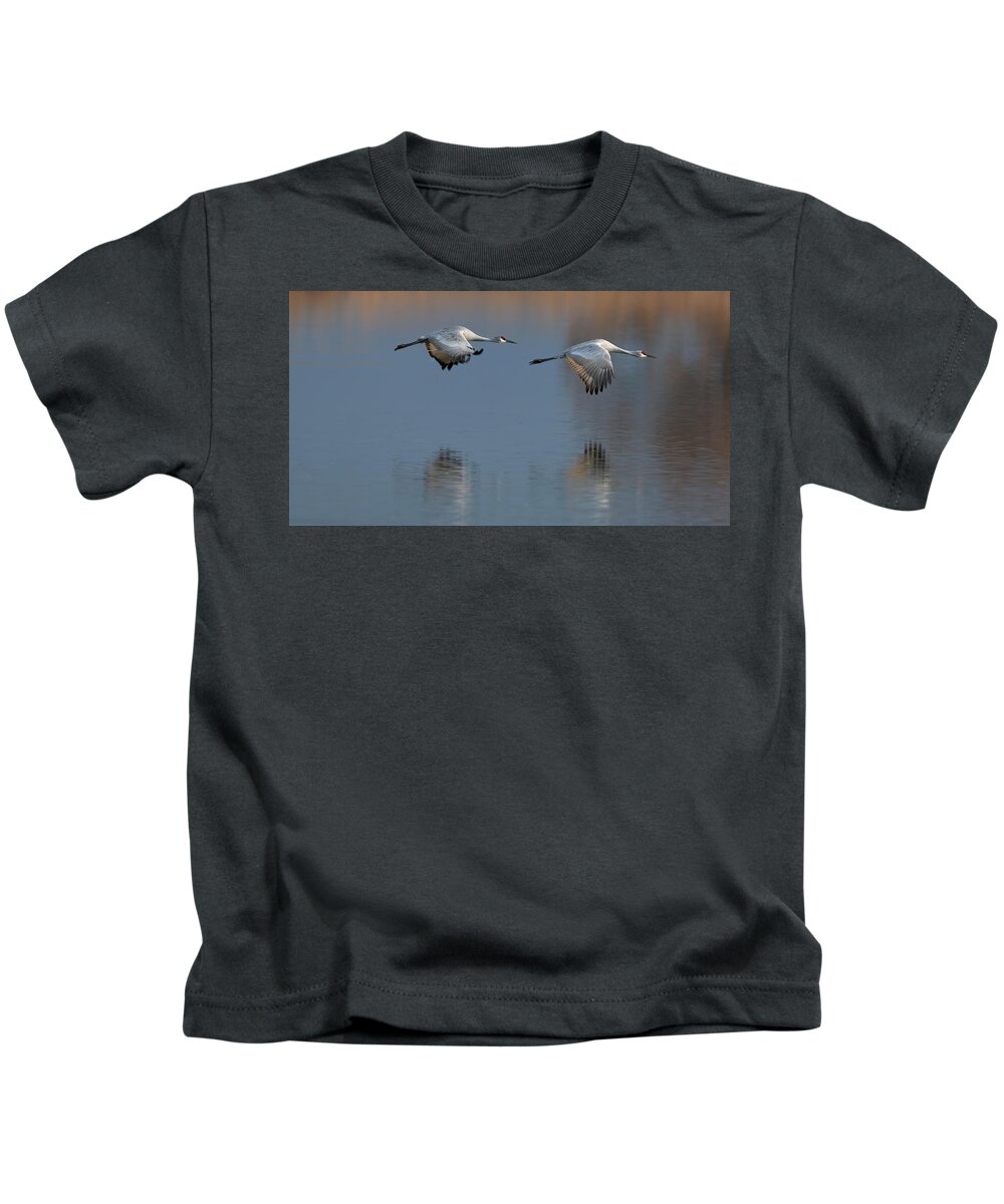Sand Hill Kids T-Shirt featuring the photograph SandHill Crane returning by Gary Langley
