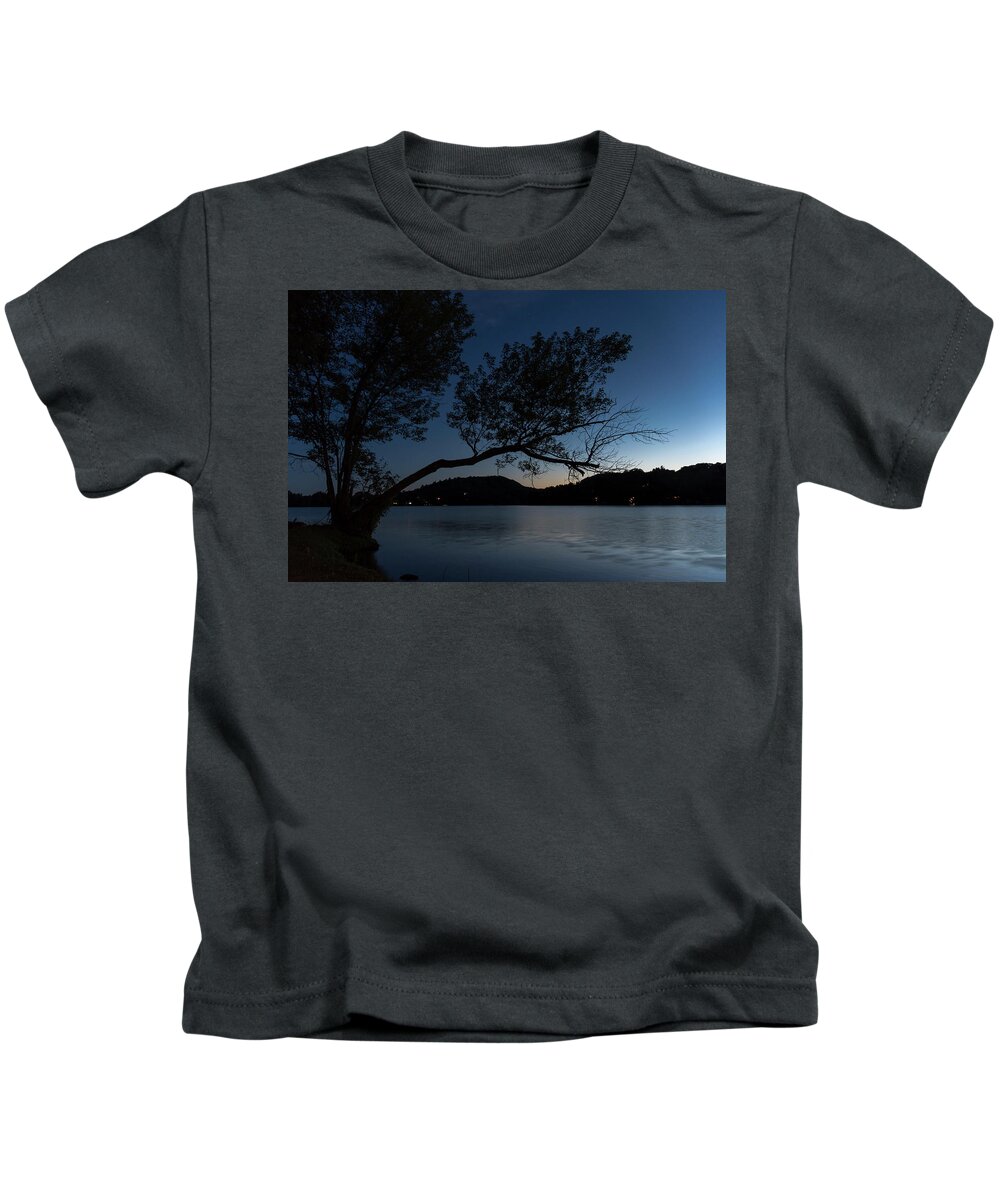 Cottage Kids T-Shirt featuring the photograph Silhouetted Tree over a Lake by John Twynam