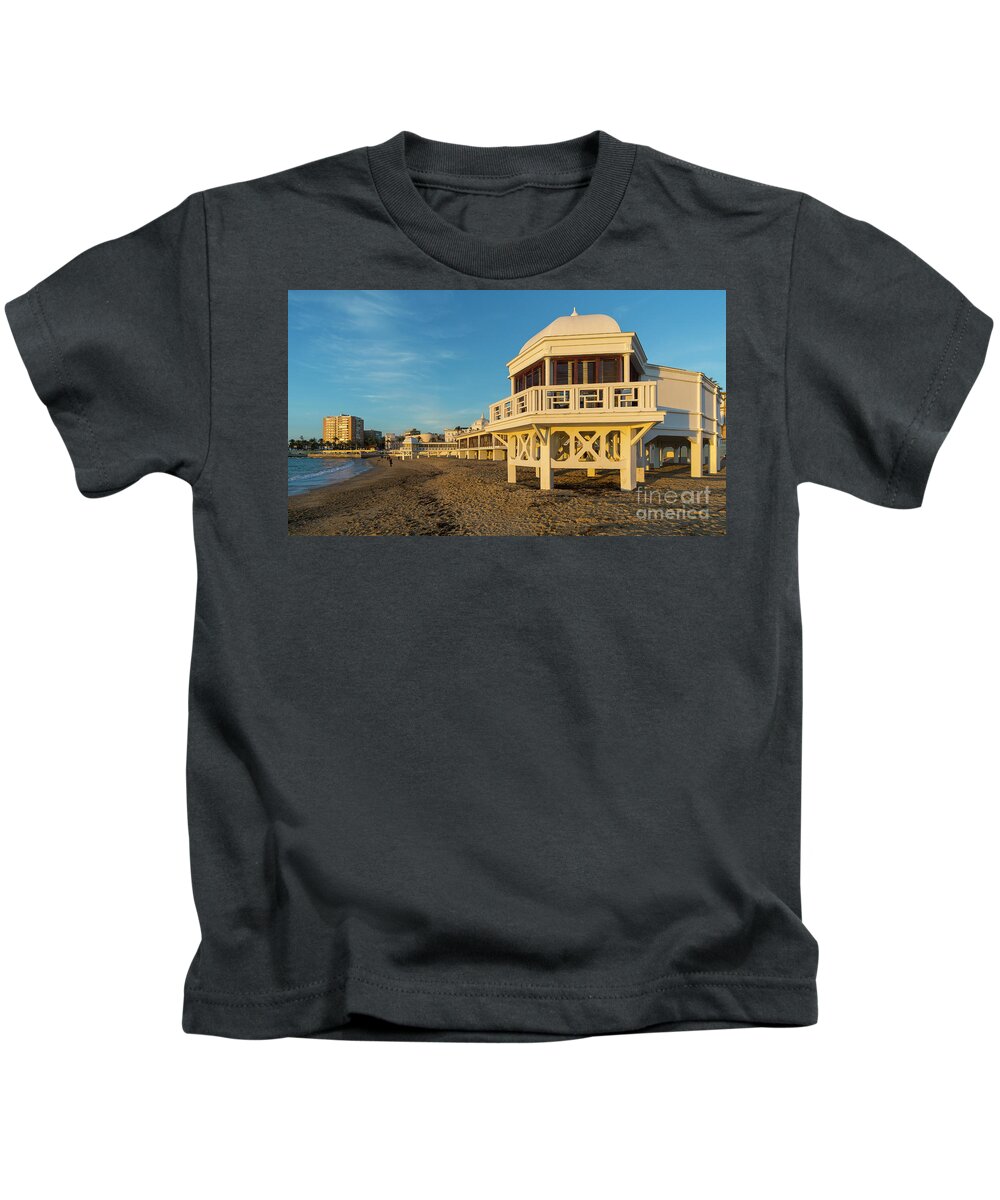 Seascape Kids T-Shirt featuring the photograph Spa at La Caleta under a Blue Sky Beach in Cadiz Andalusia by Pablo Avanzini