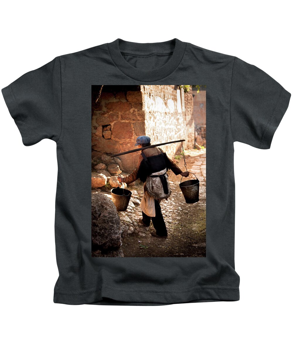 China Kids T-Shirt featuring the photograph The Water Carrier by Mark Gomez
