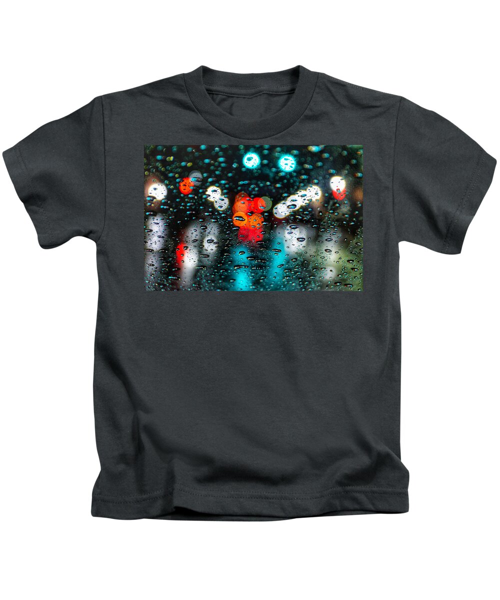 Photo Kids T-Shirt featuring the photograph Traffic through the Rain by Evan Foster