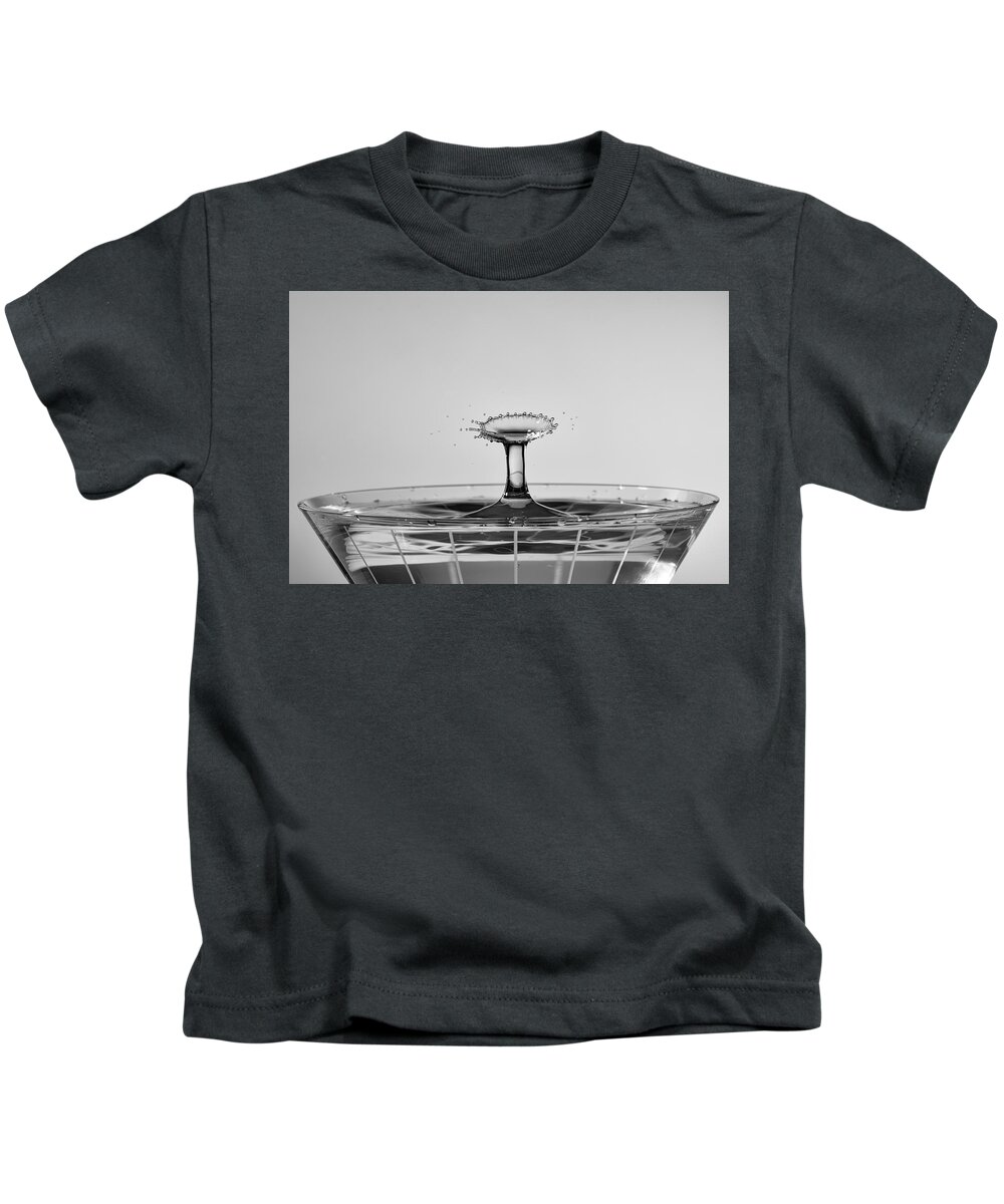 North Wilkesboro Kids T-Shirt featuring the photograph Water Drops Collide Over Martini Glass Monochrome by Charles Floyd