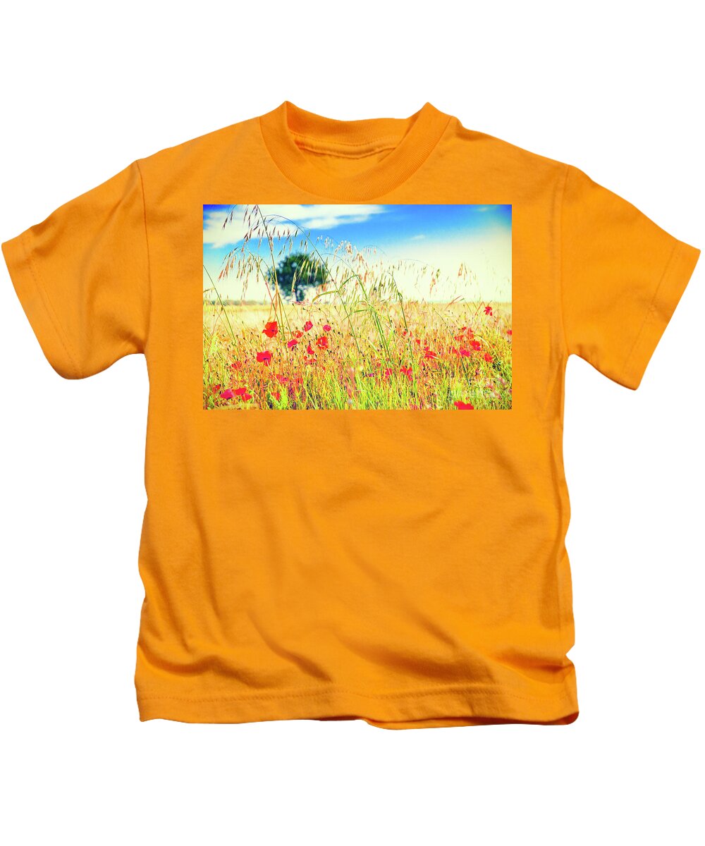 Field Kids T-Shirt featuring the photograph Poppies with tree in the distance #1 by Silvia Ganora