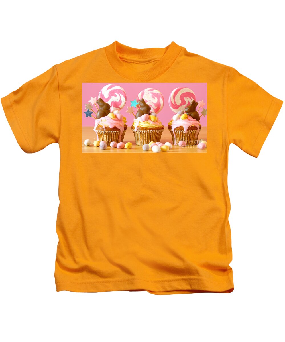 Easter Kids T-Shirt featuring the photograph Easter theme candy land drip cupcakes in party table setting. #1 by Milleflore Images