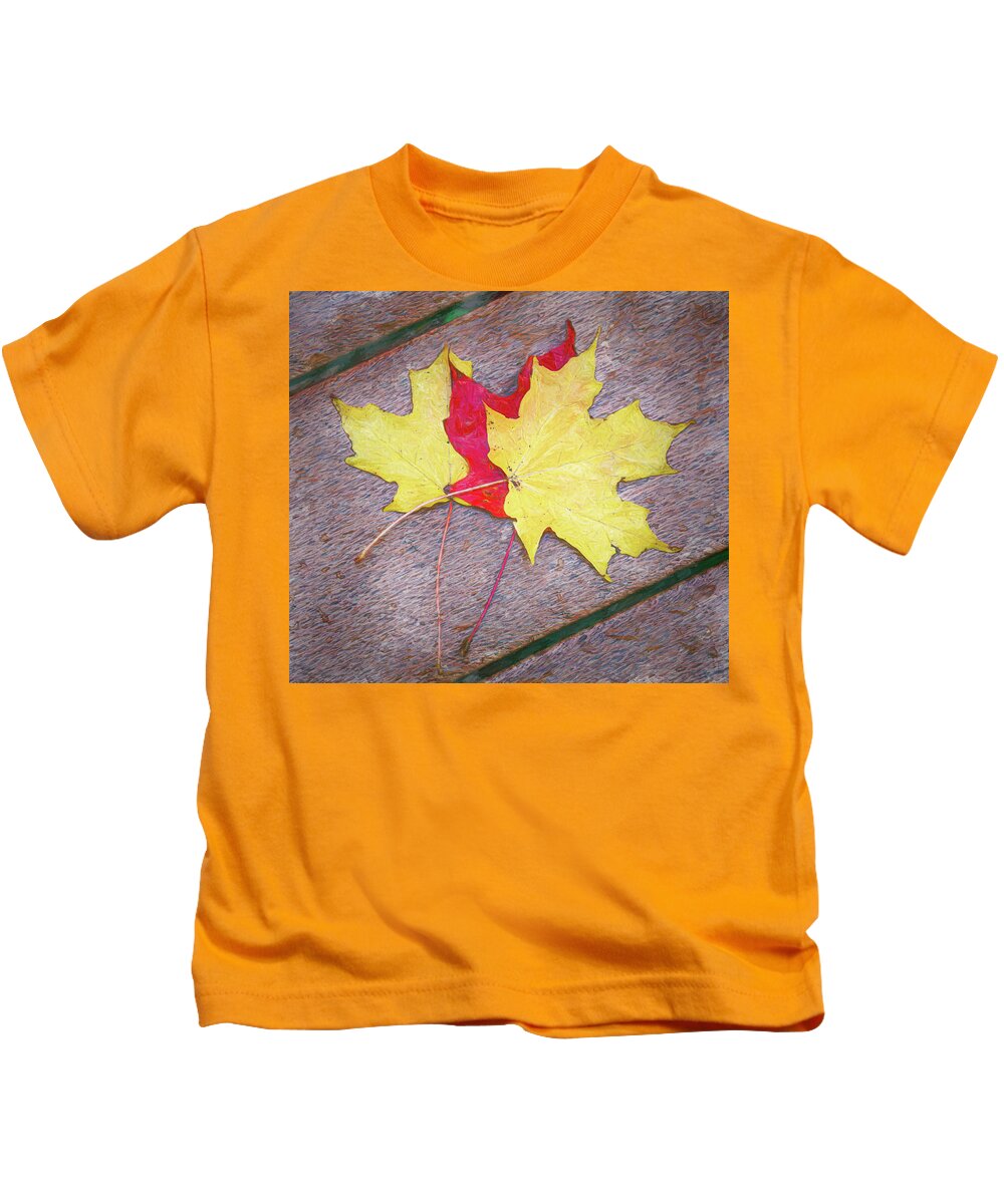 Holmdel Park Kids T-Shirt featuring the photograph Three Autumn Leaves On A Bench by Gary Slawsky