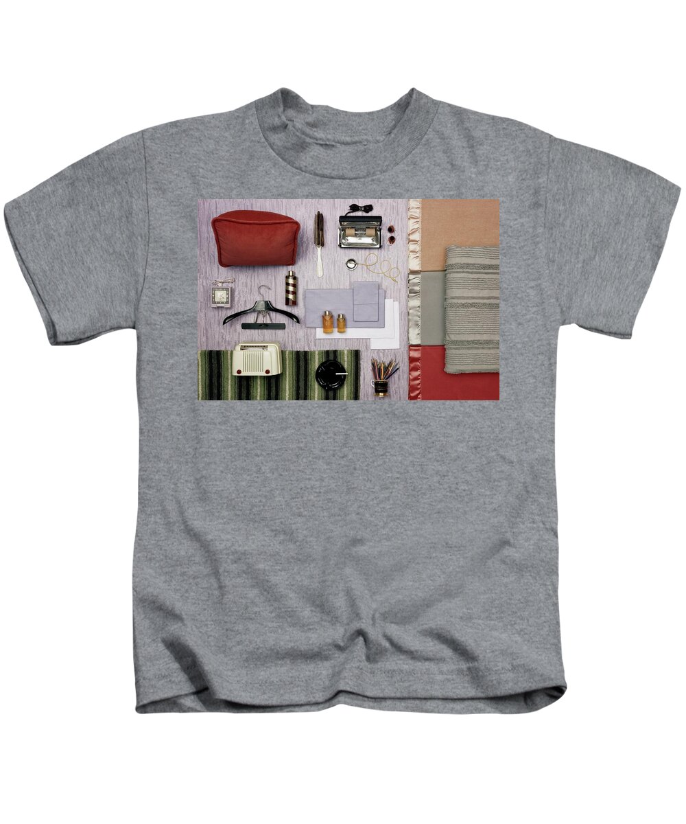 Studio Shot Kids T-Shirt featuring the photograph A Group Of Household Objects #1 by Geoffrey Baker