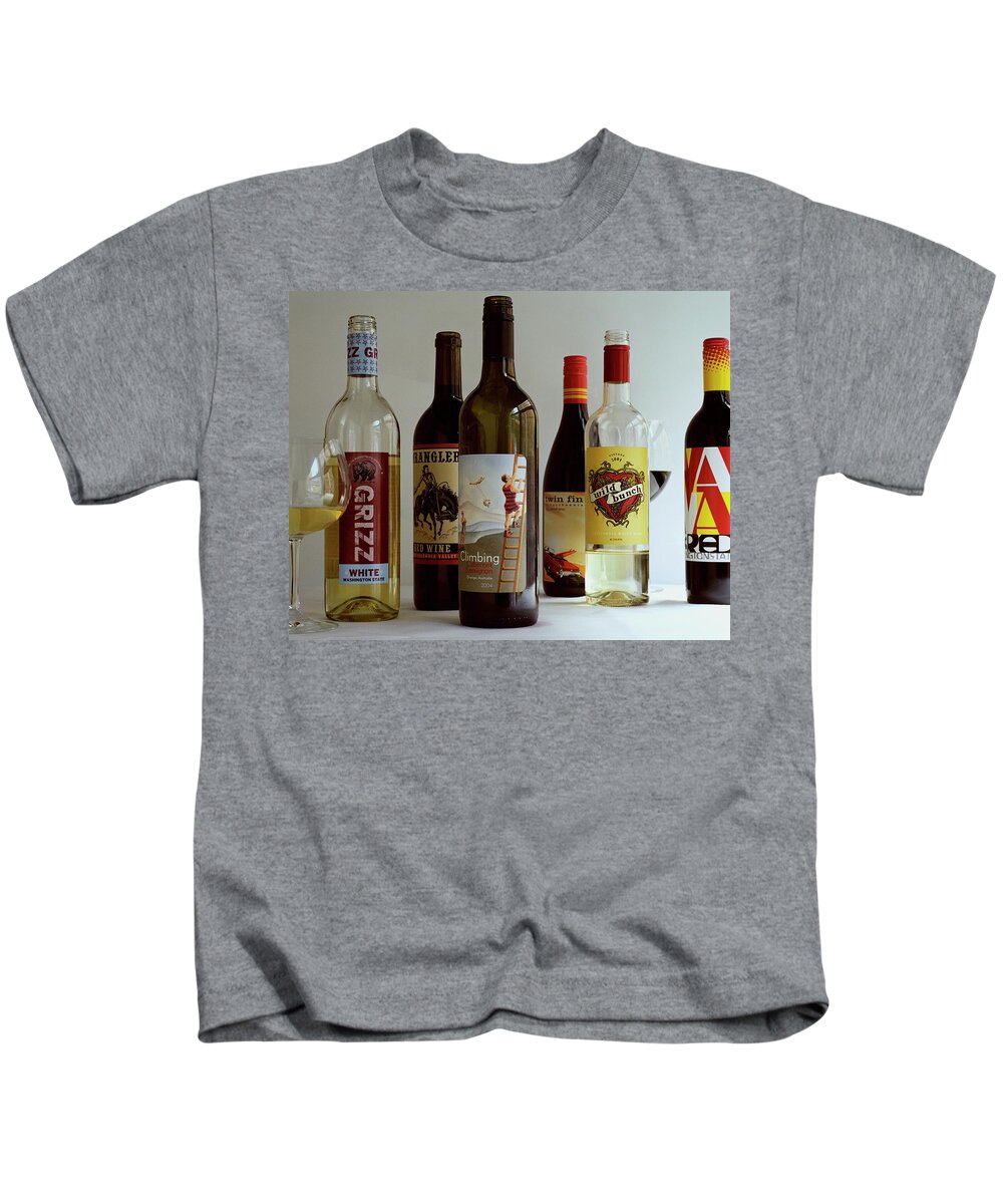 Food Kids T-Shirt featuring the photograph A Collection Of Wine Bottles by Romulo Yanes