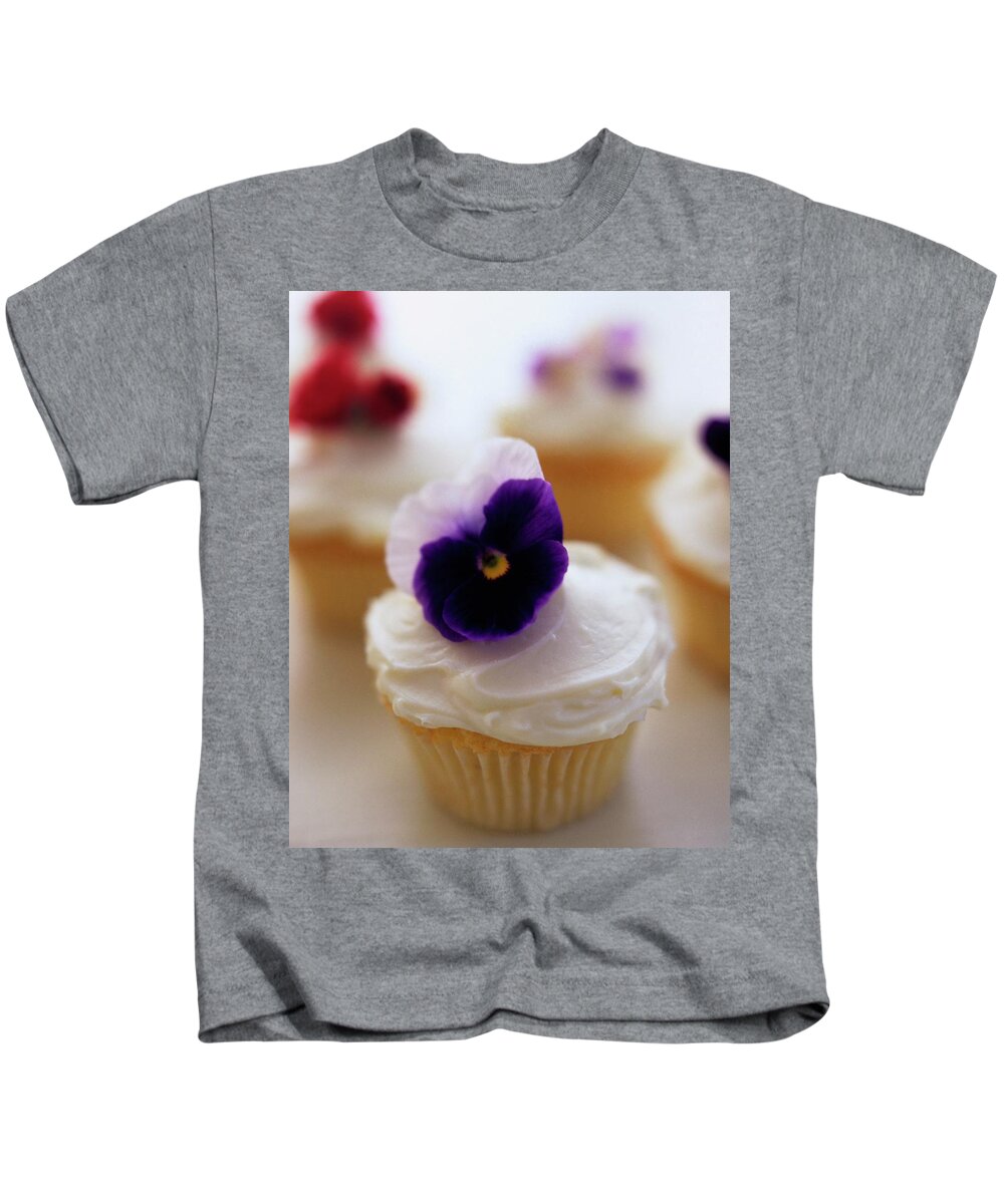 Bridal Kids T-Shirt featuring the photograph A Cupcake With A Violet On Top by Romulo Yanes
