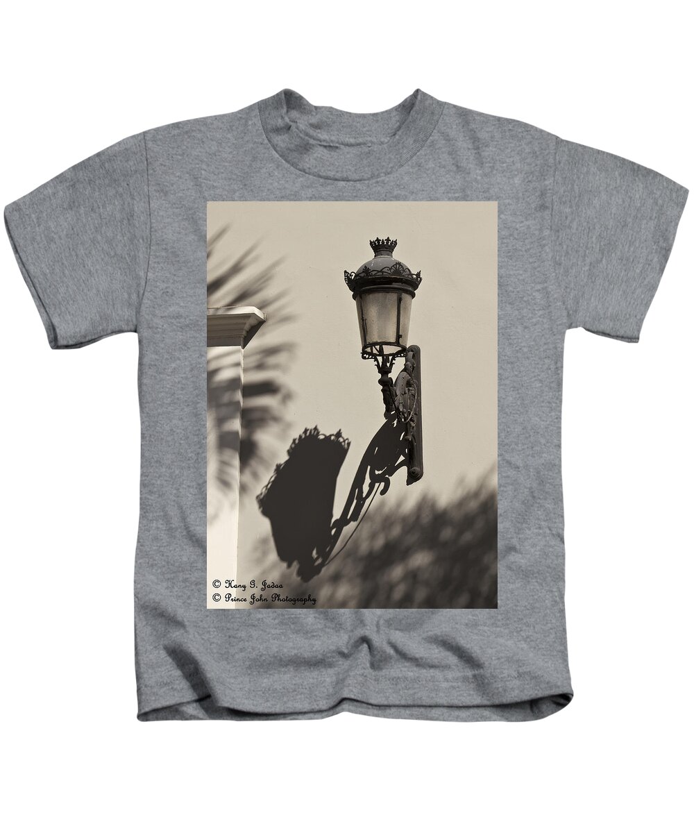 Lamp Post Kids T-Shirt featuring the photograph A Reflection On Illumination by Hany J