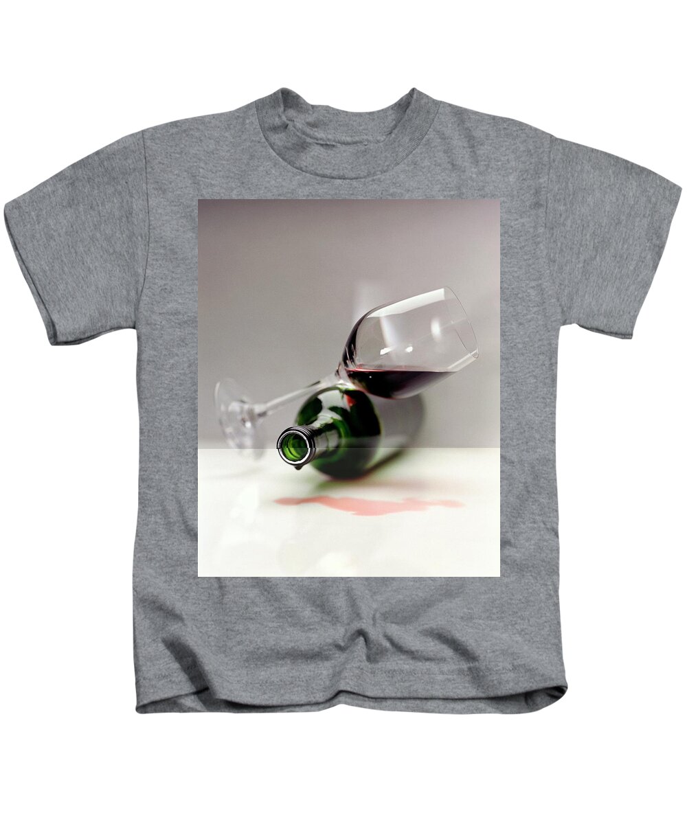 Beverage Kids T-Shirt featuring the photograph A Wine Bottle And A Glass Of Wine by Romulo Yanes