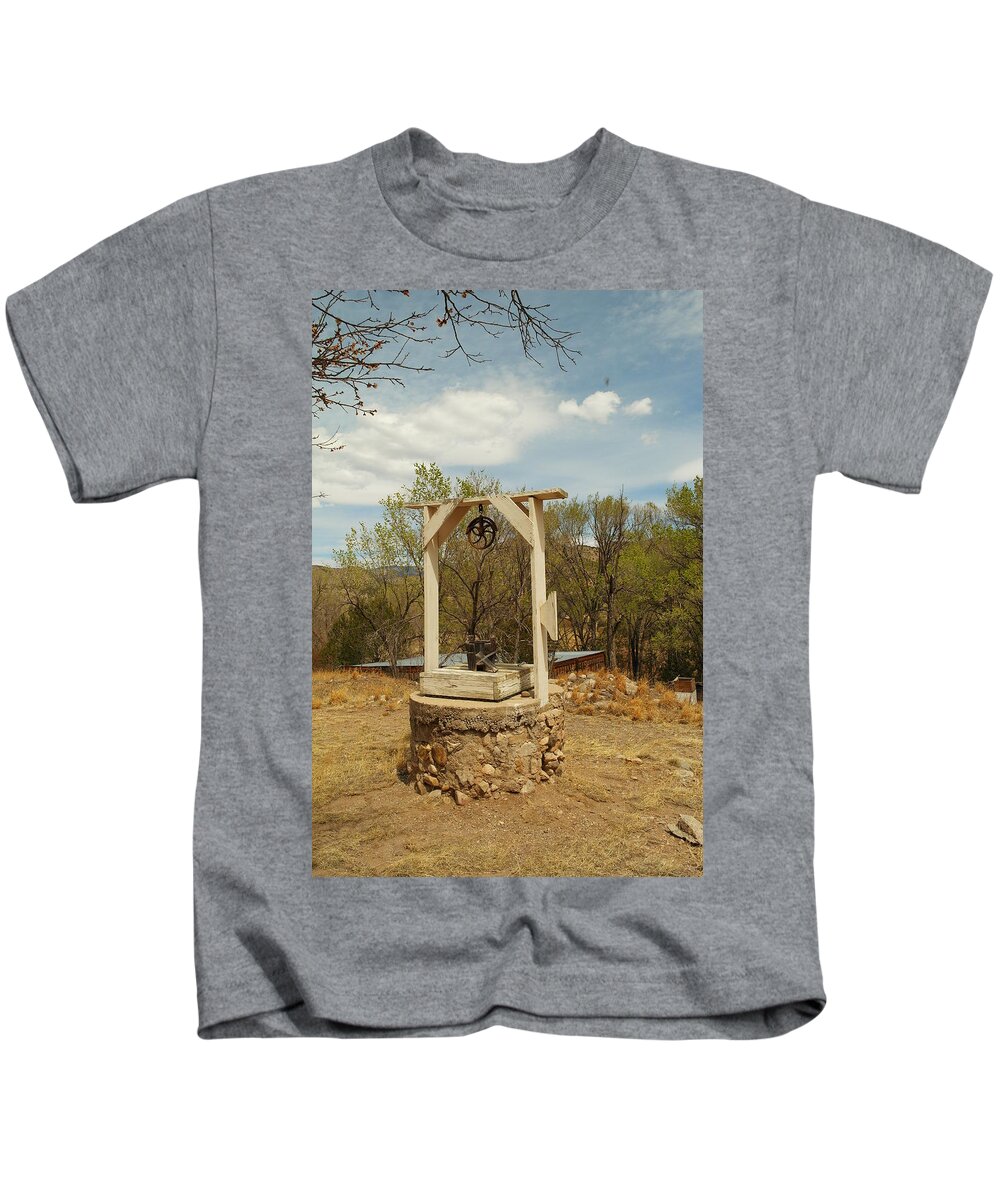 Water Kids T-Shirt featuring the photograph An Old Well In Lincoln City New Mexico by Jeff Swan