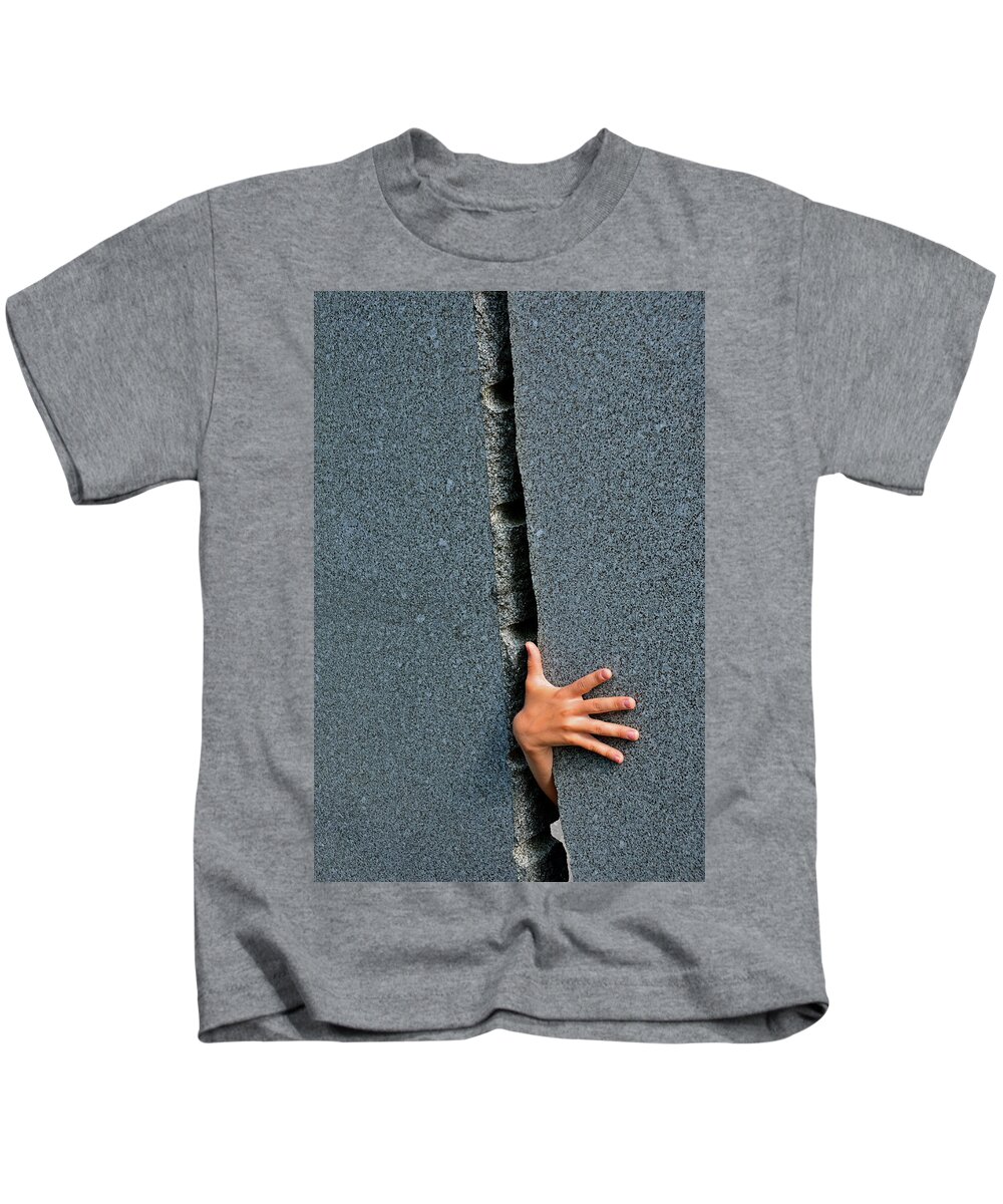 Hand Kids T-Shirt featuring the photograph Breakthrough by Andreas Berthold