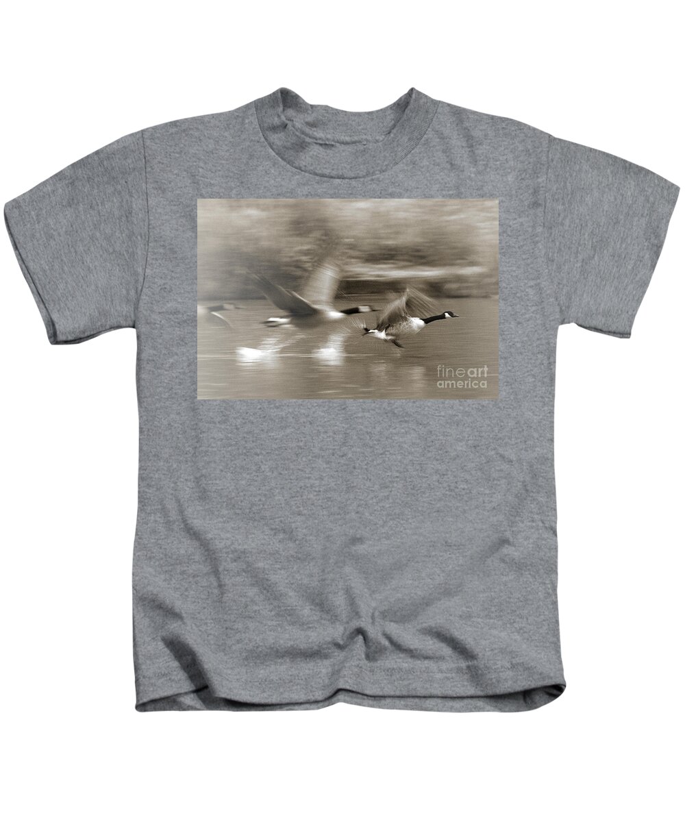 Canada Geese Kids T-Shirt featuring the photograph In a Blur of Feathers by Jeremy Hayden