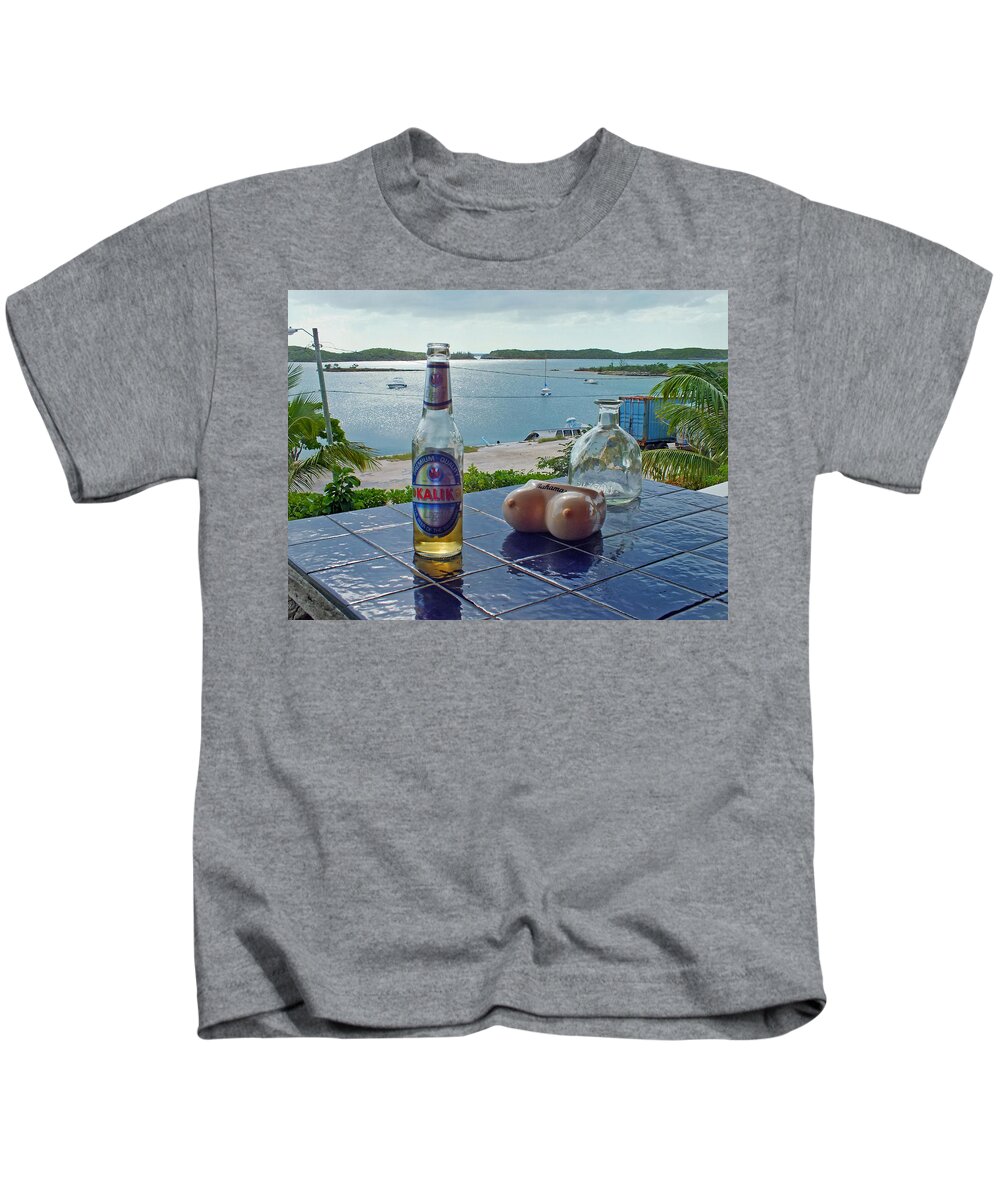 Duane Mccullough Kids T-Shirt featuring the photograph Kalik Beer Bottle at the Front Porch by Duane McCullough