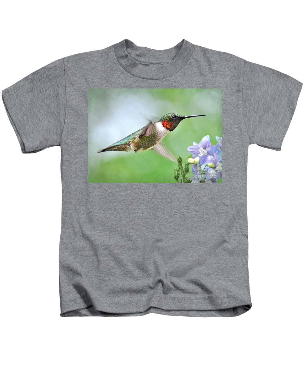 Hummingbird Kids T-Shirt featuring the photograph Male Hummingbird Hovering Over Lavender Lapspar Flowers by Kathy Baccari