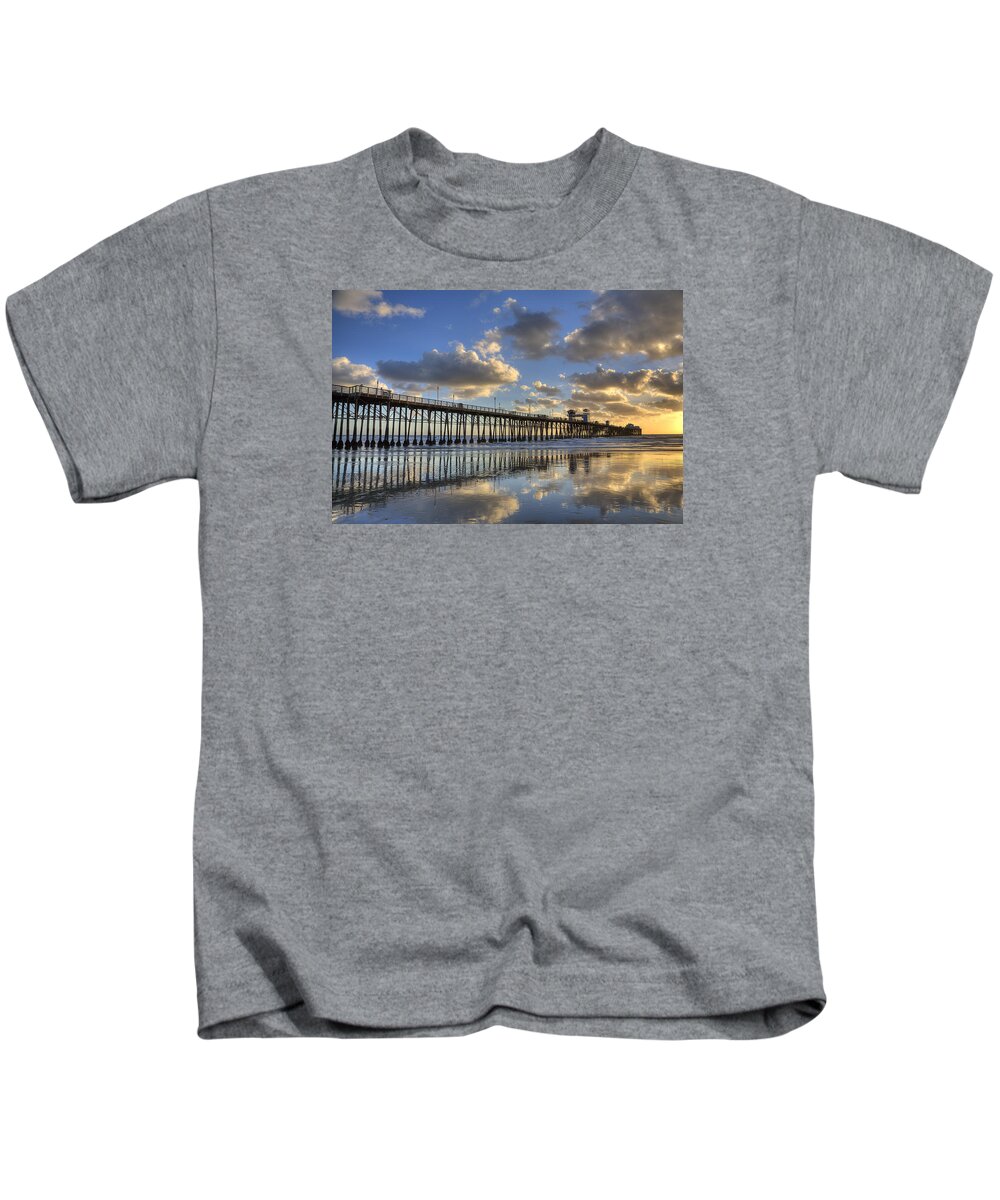 California Kids T-Shirt featuring the photograph Oceanside Pier Sunset Reflection by Peter Tellone