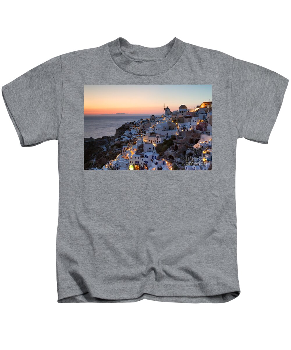 Greece Kids T-Shirt featuring the photograph Romantic sunset over the village of Oia Greece Santorini by Matteo Colombo