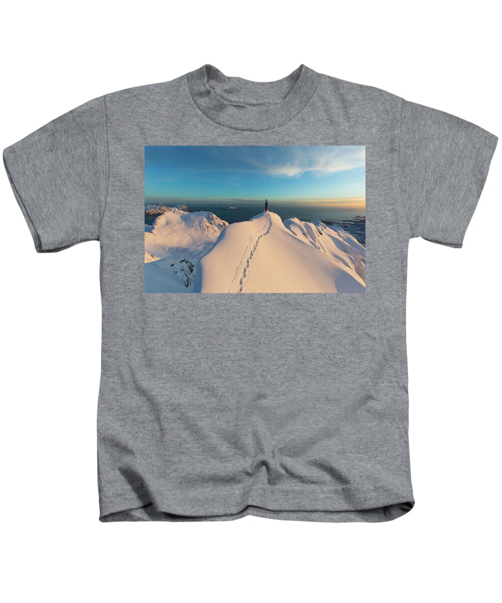 Achievement Kids T-Shirt featuring the photograph Skier On Top Of Snowy Mountain Peak by Adam Clark
