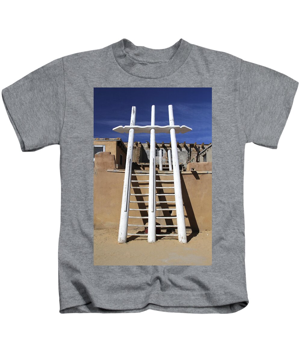 Acoma Pueblo Kids T-Shirt featuring the photograph The Ladder Acoma Pueblo by Mike McGlothlen