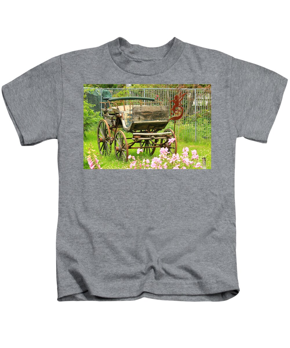 Aged Kids T-Shirt featuring the photograph Vintage horse carriage in a flower bed by Amanda Mohler