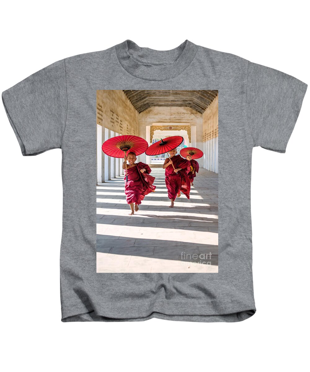 Children Kids T-Shirt featuring the photograph Young buddhist monks on the run - Myanmar by Matteo Colombo