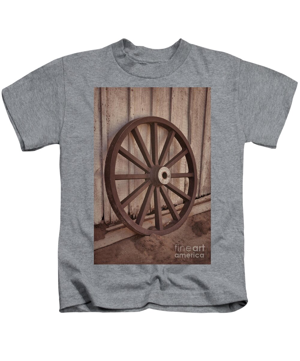 Old Kids T-Shirt featuring the photograph An Old Wagon Wheel by Donna Greene