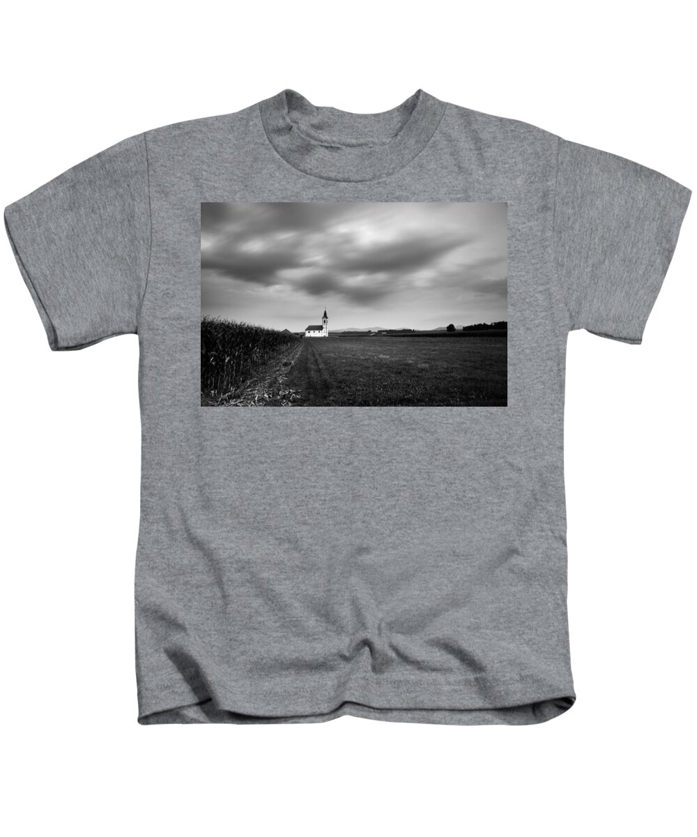 Dusk Kids T-Shirt featuring the photograph Storm clouds gather over church by Ian Middleton