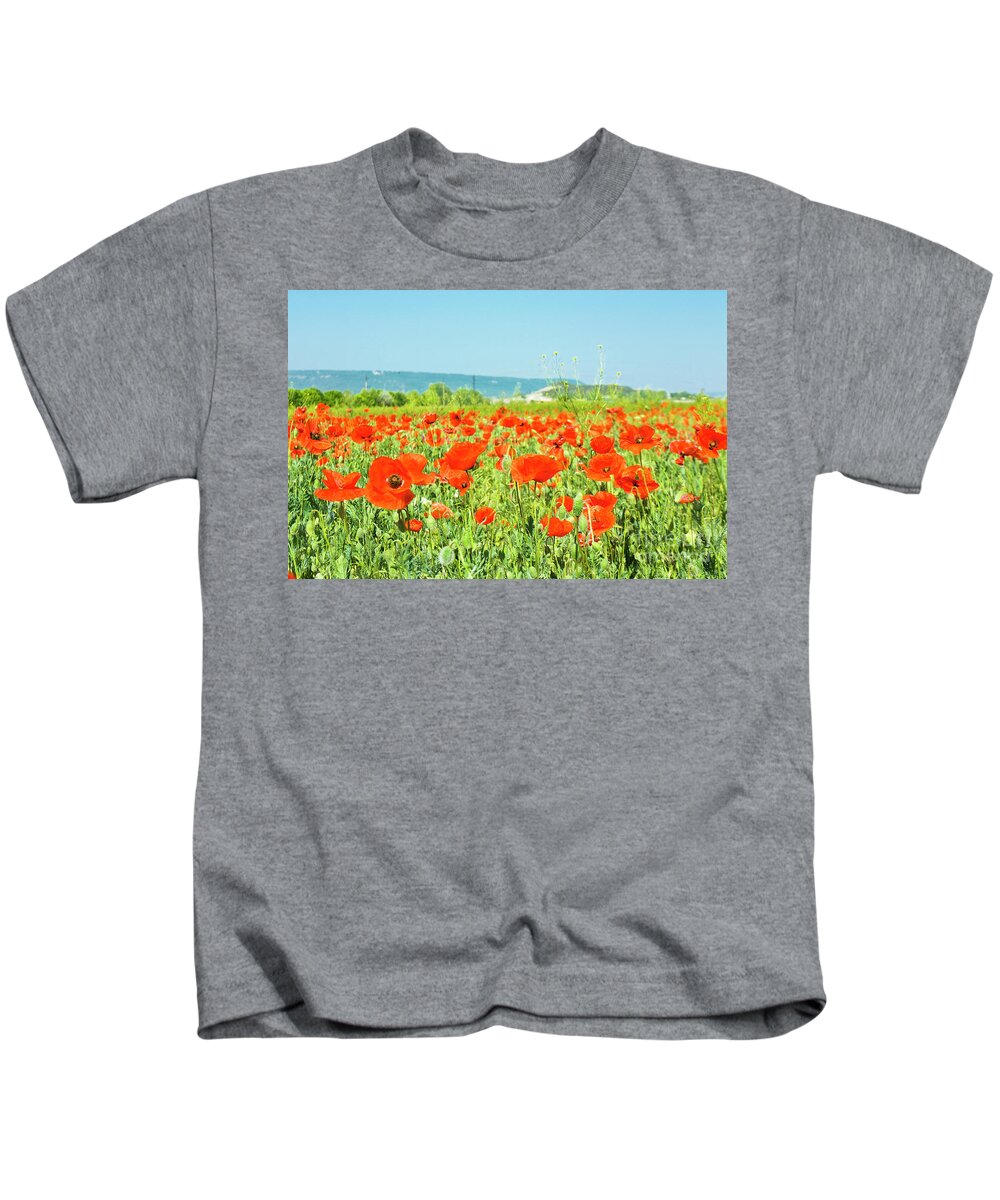 Red Kids T-Shirt featuring the photograph Meadow with red poppies #1 by Irina Afonskaya