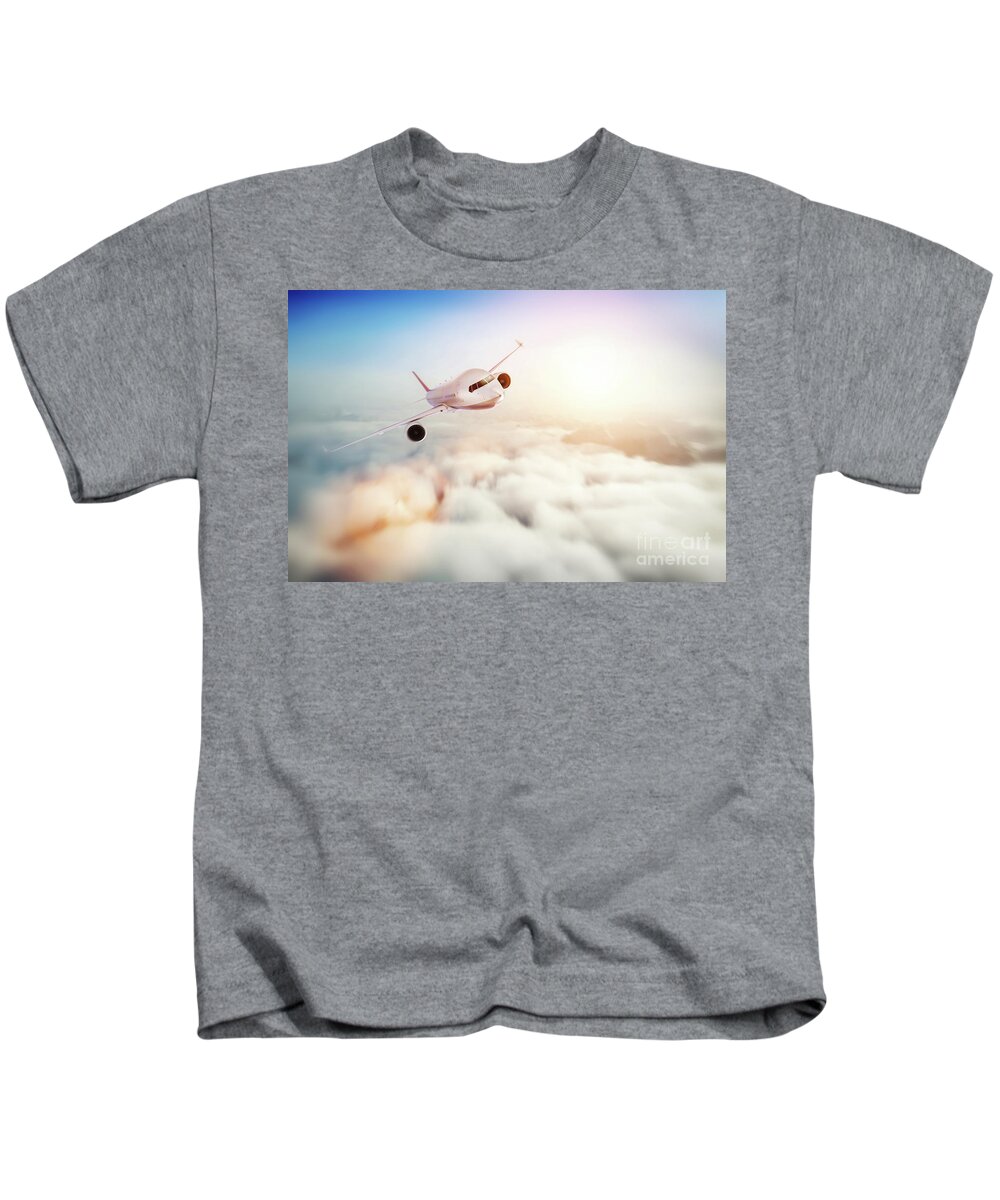 Airplane Kids T-Shirt featuring the photograph Passenger airplane flying at sunset, blue sky. #1 by Michal Bednarek