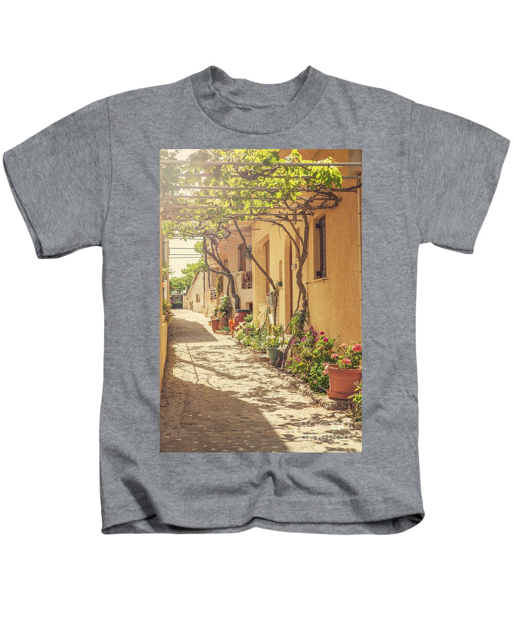 Greece Kids T-Shirt featuring the photograph Back street in Cretan village. by Sophie McAulay