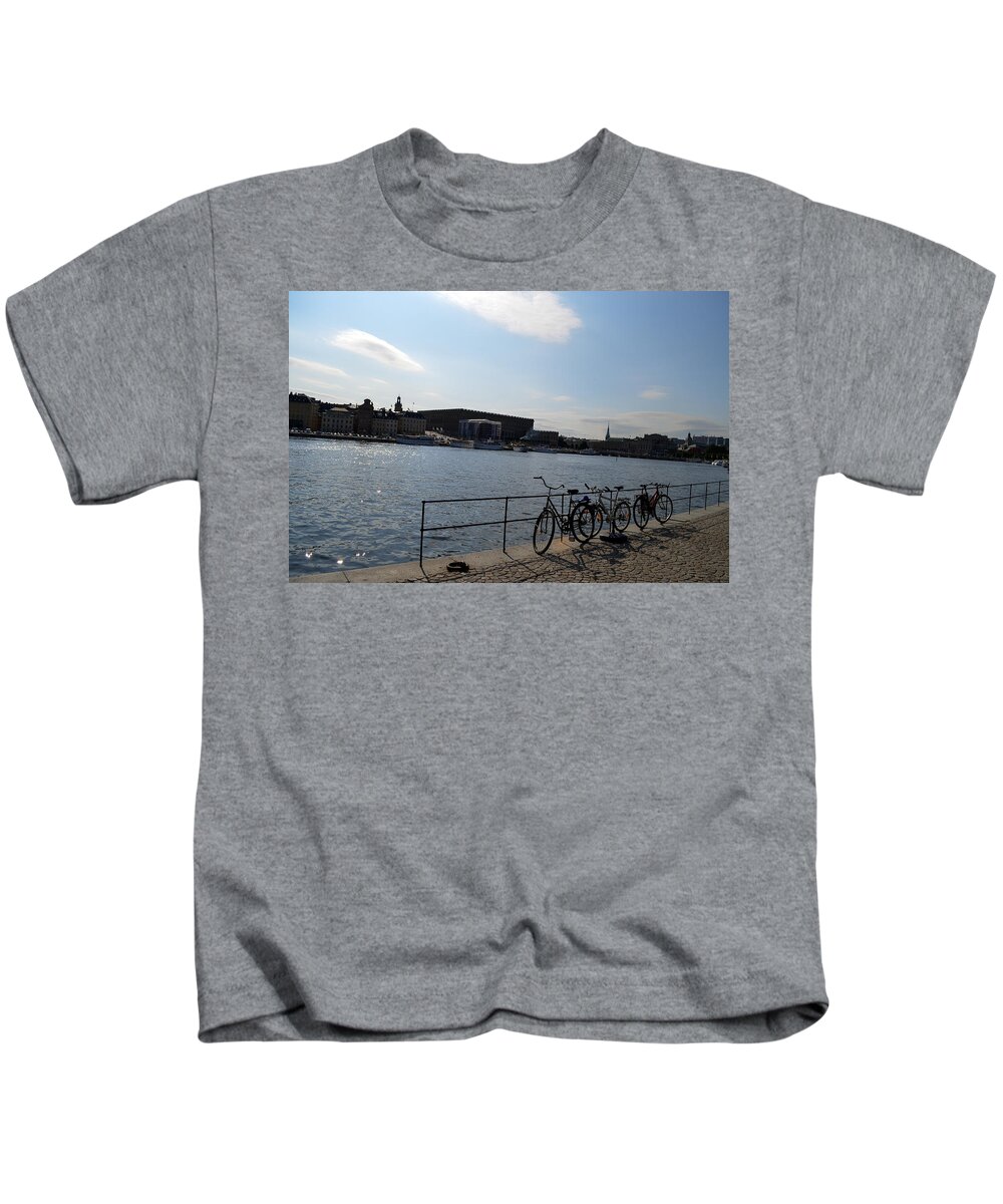 Bikes Kids T-Shirt featuring the photograph Bikes in Stockholm by Erik Burg