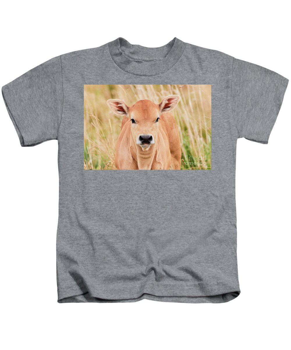 Calf Kids T-Shirt featuring the photograph Calf in the high grass by Nick Biemans