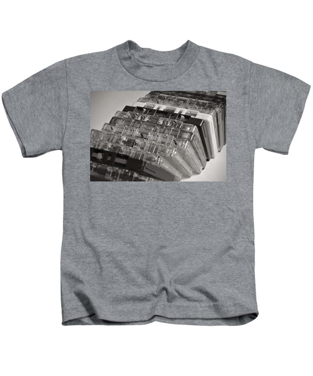 Audio Cassette Kids T-Shirt featuring the photograph Collection of Audio Cassettes with Domino Effect by Angelo DeVal