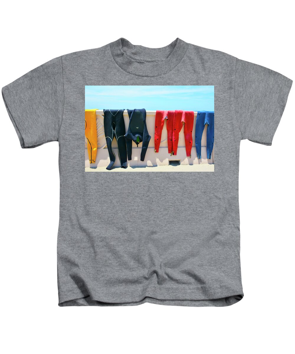 Wetsuits Surfer Colorful Beach Wall Sea Blue Sky Red Yellow Sport Water Ocean Waves Human Form Kids T-Shirt featuring the photograph Hang Ten by Jennifer Wright