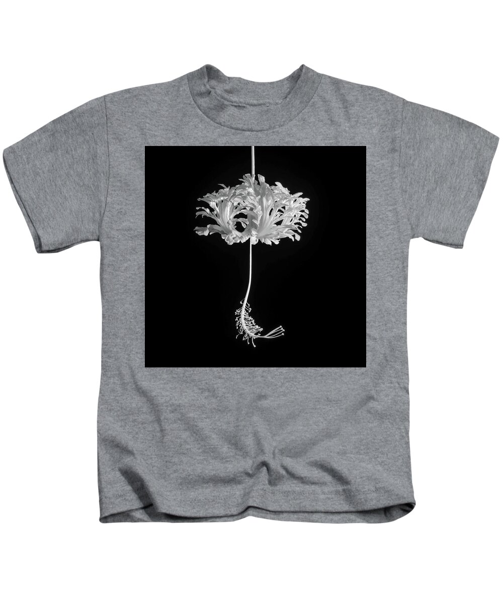 Hibiscus Kids T-Shirt featuring the photograph Hibiscus Schizopetalus Against a Black Background in Black and White by Christopher Johnson