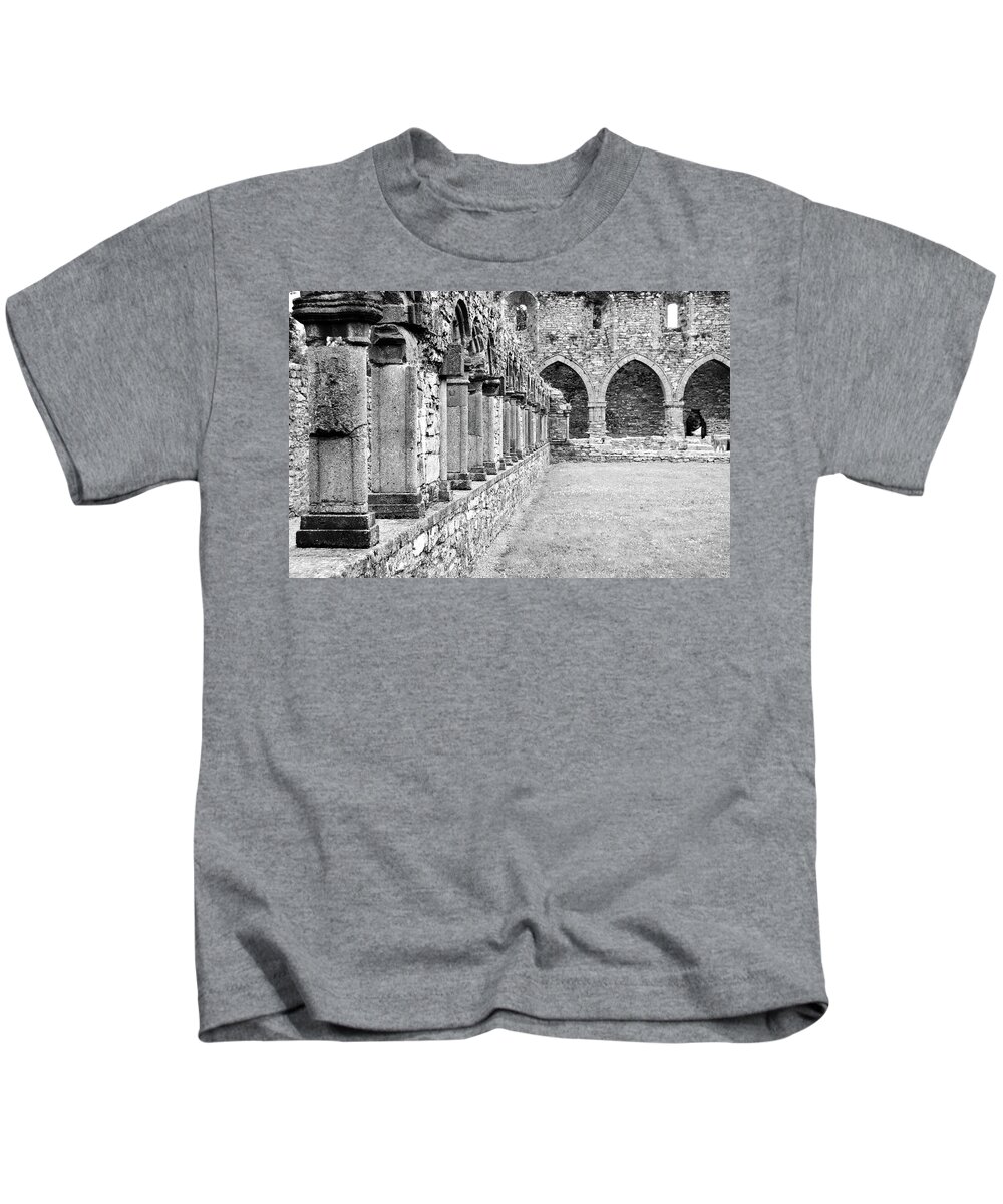 Travelpixpro Ireland Kids T-Shirt featuring the photograph Ireland Jerpoint Abbey Cloister Arcade Columns Irish Churches County Kilkenny Black and White by Shawn O'Brien