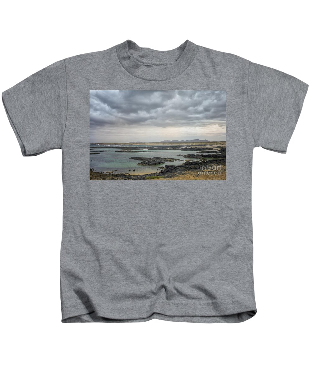 Fuerteventura Kids T-Shirt featuring the photograph Lava coast and ocean by Patricia Hofmeester