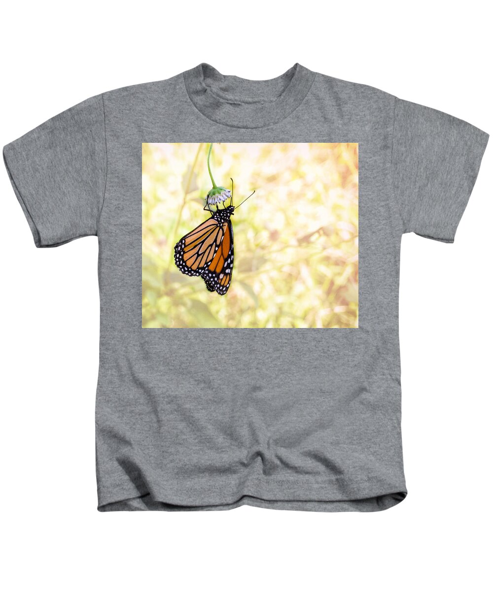 Monarch Butterfly Kids T-Shirt featuring the photograph Monarch Butterfly Hanging on Wildflower by Louise Lindsay