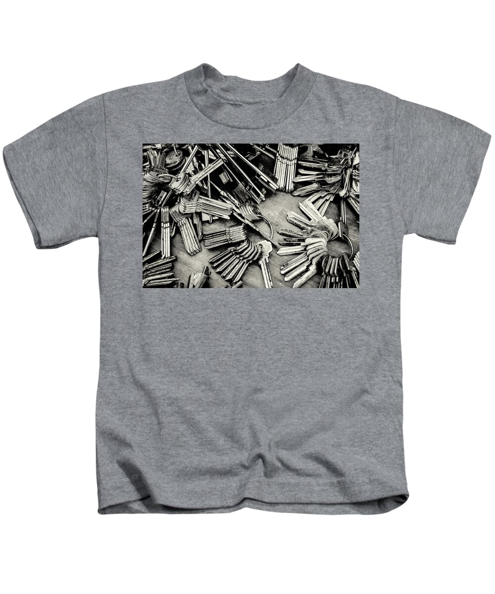 Metal Key Kids T-Shirt featuring the photograph Piles of Blank Keys in Monochrome by John Williams