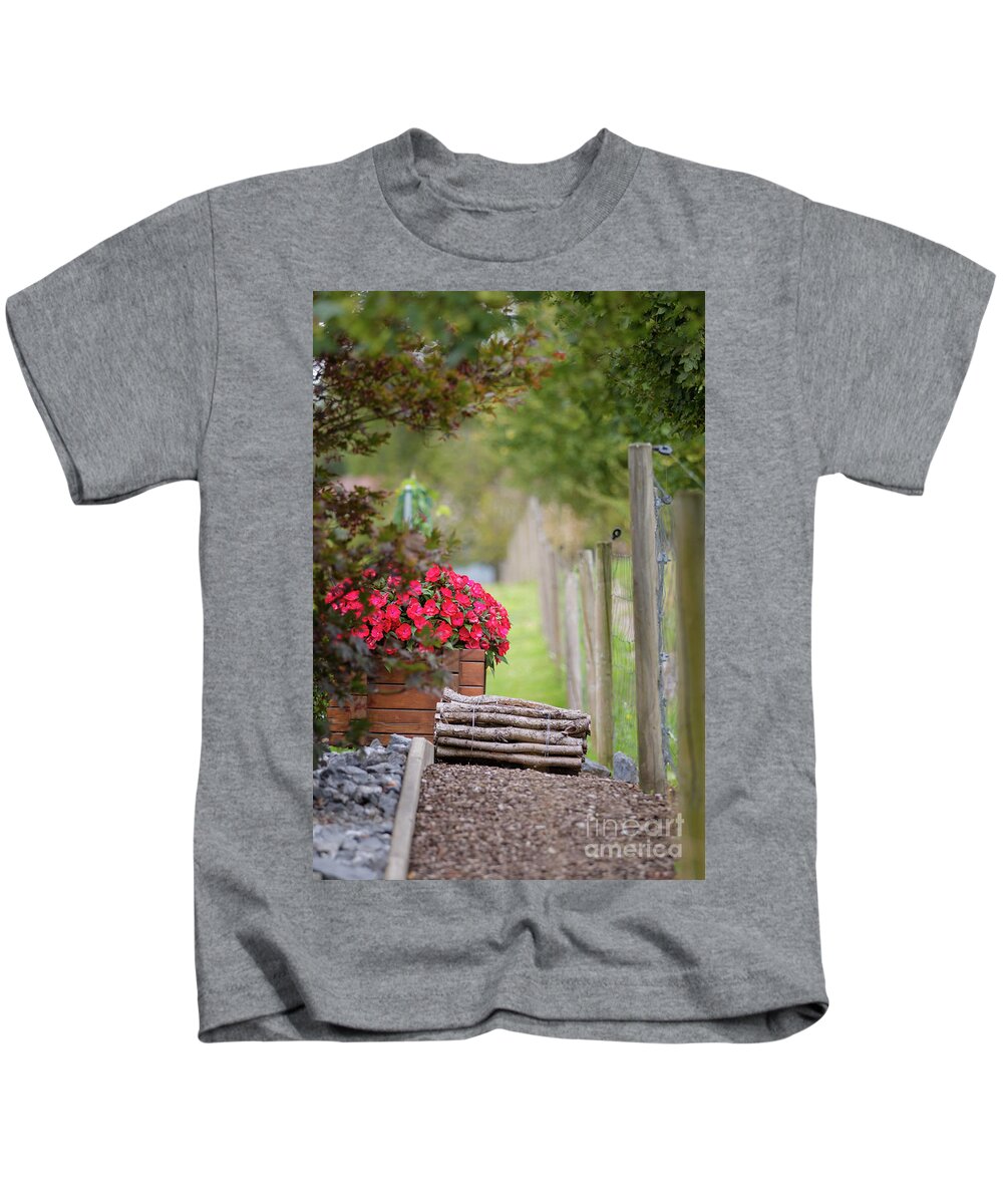 Country Kids T-Shirt featuring the photograph Red flowerd with Fende and wood billet bundle by Amanda Mohler
