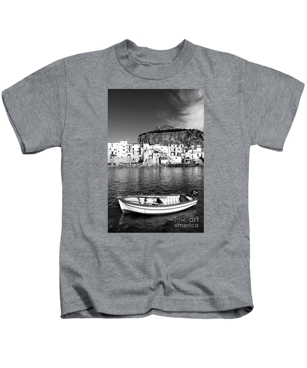 Fishing Boat Kids T-Shirt featuring the photograph Rowboat along an idyllic Sicilian village. by Stefano Senise