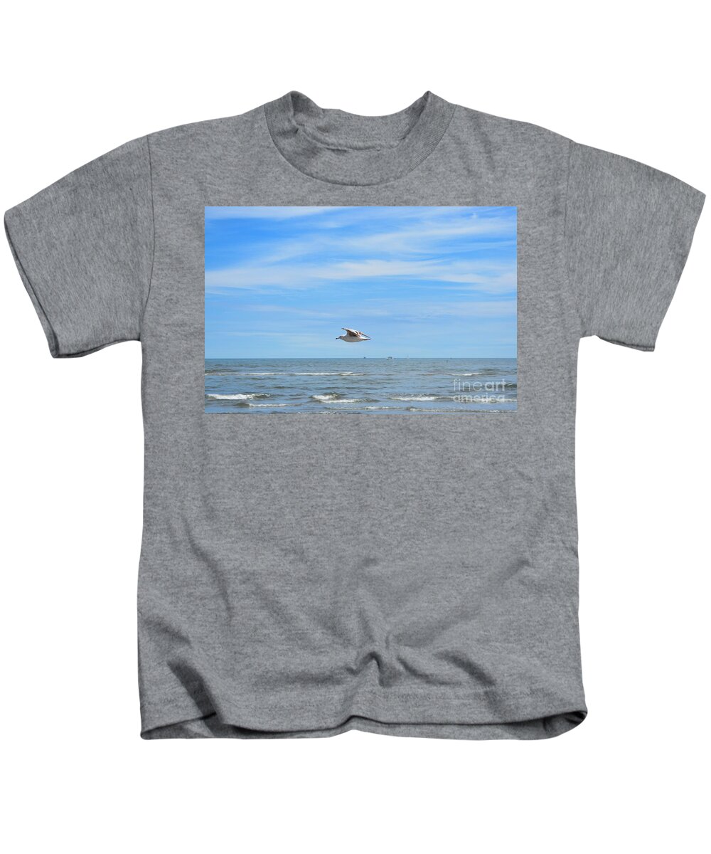 Seagull Kids T-Shirt featuring the photograph Seagull in Flight by Dani McEvoy