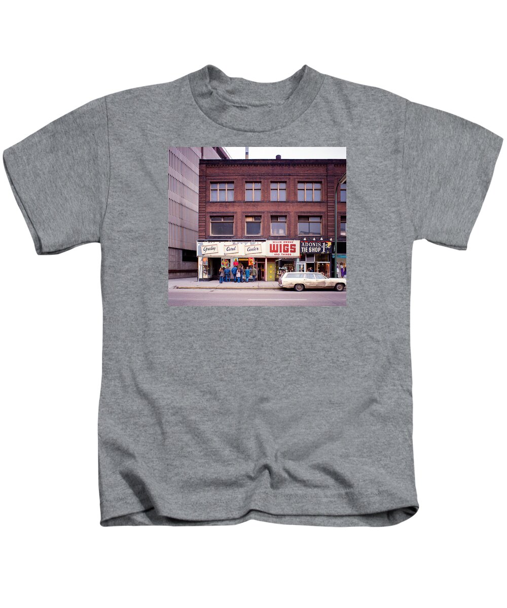 Downtown_printed Kids T-Shirt featuring the photograph Something's going on at the Greeting Card Center. by Mike Evangelist