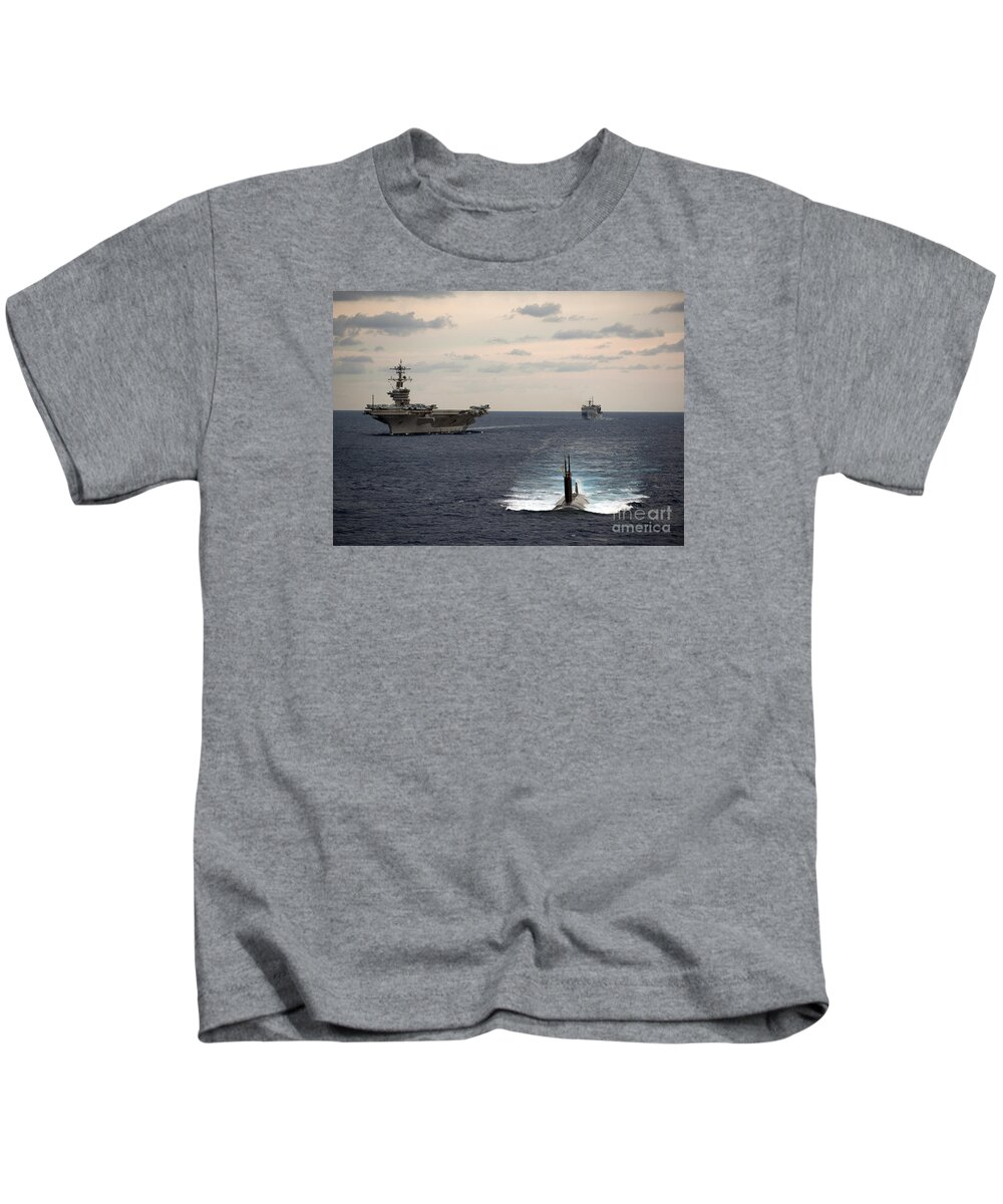 The Nimitz-class Aircraft Carrier Uss Carl Vinson And A Submarine Kids T-Shirt featuring the painting The Nimitz-class aircraft carrier USS Carl Vinson and a submarine by Celestial Images