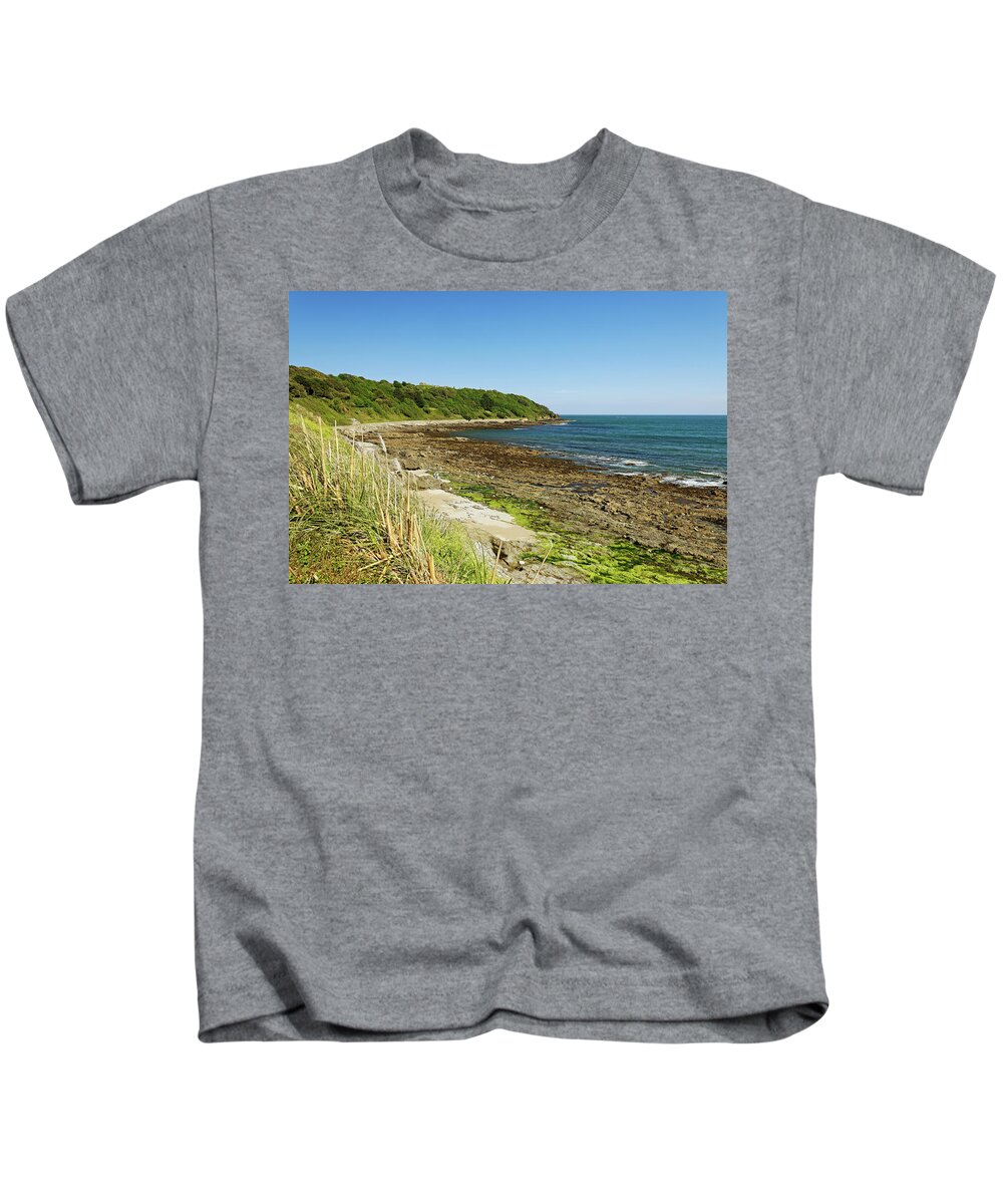 Britain Kids T-Shirt featuring the photograph The Rugged Castle Beach - Falmouth by Rod Johnson
