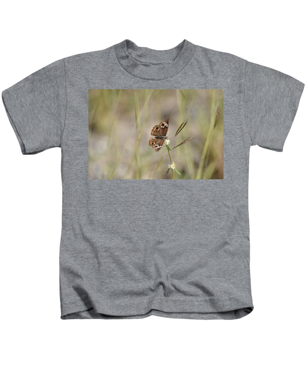 Butterfly Kids T-Shirt featuring the photograph Buckeye Butterfly Resting On White Flowers - Horizontal by Artful Imagery